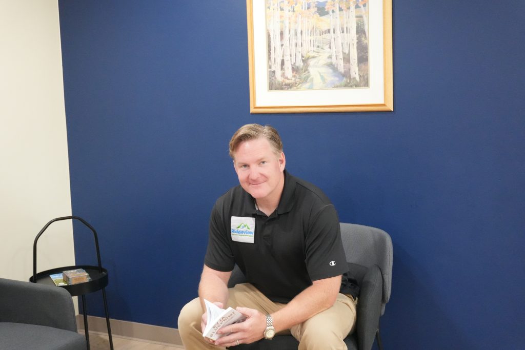Dr. Kroner seated in the Ridgeview Direct Care office in Wheat Ridge